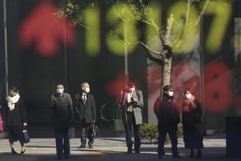 Japan shares fall on pandemic worries as rest of Asia rises